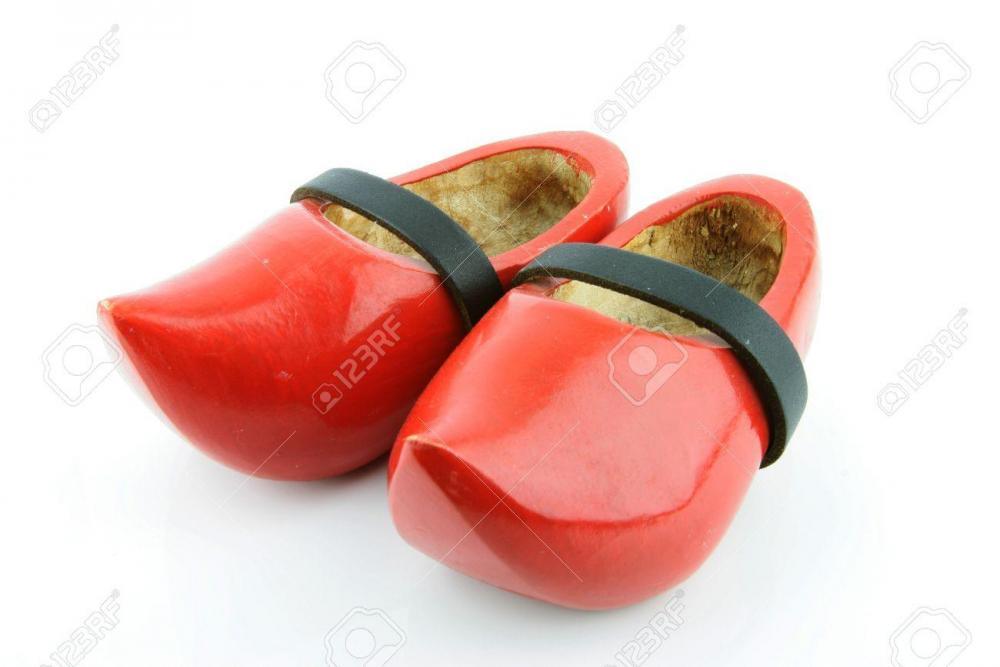 15437019-Red-wooden-shoes-Dutch-clogs-with-a-black-leather-strap-Traditional-Dutch-footwear-for-farmers-Stock-Photo[1].jpg